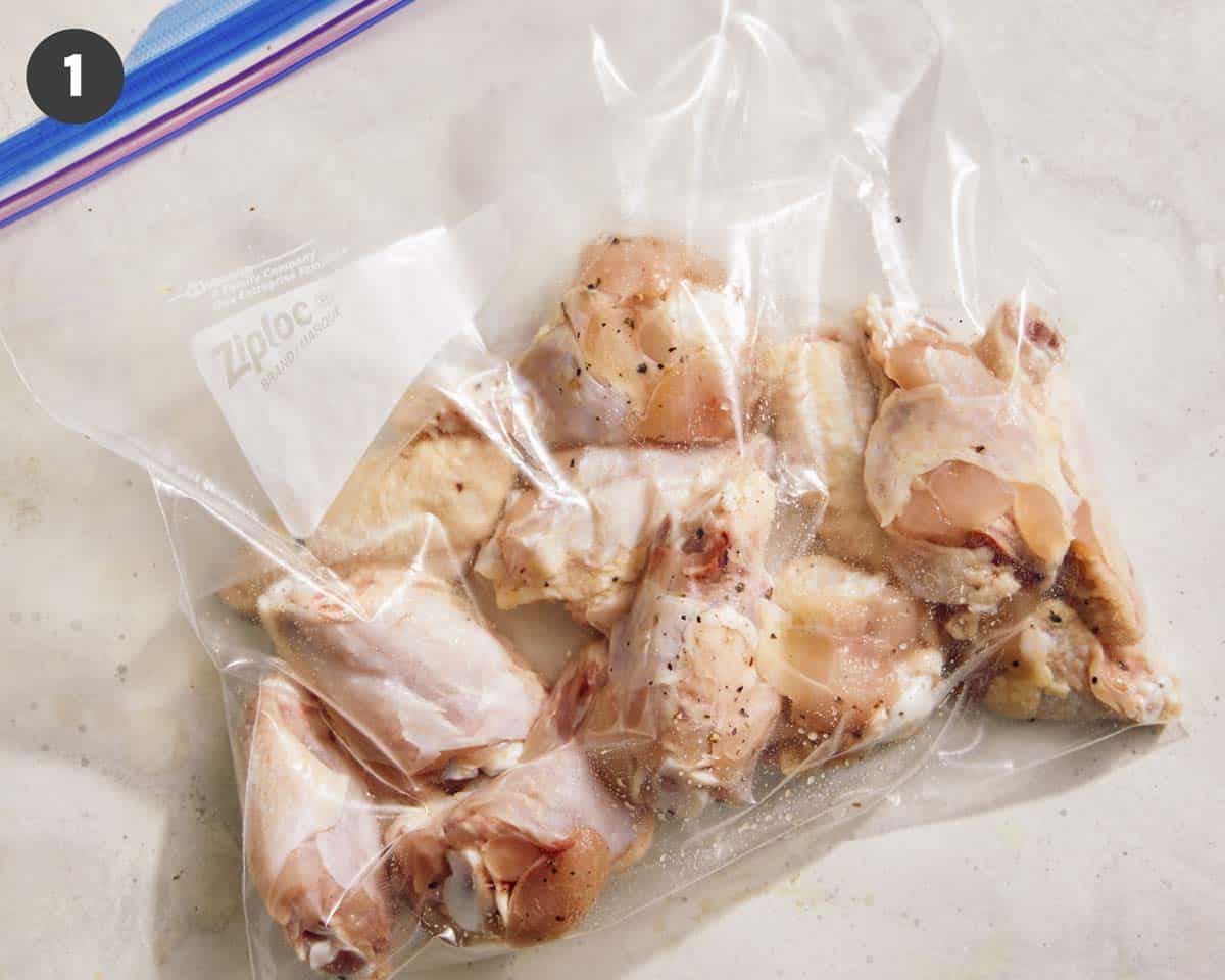 Wings in a bag with salt and pepper.