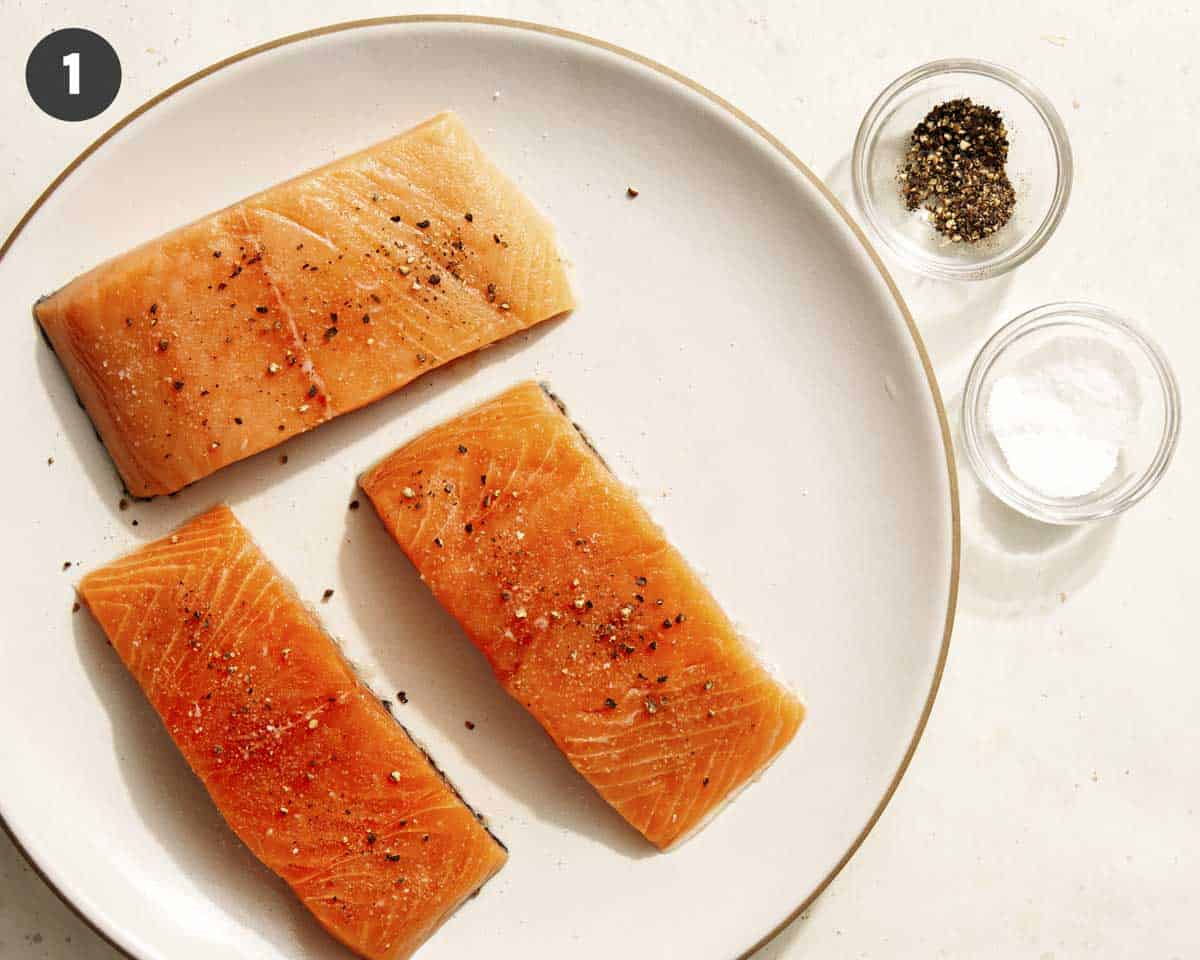 Air fryer salmon recipe seasoned with salt and pepper.