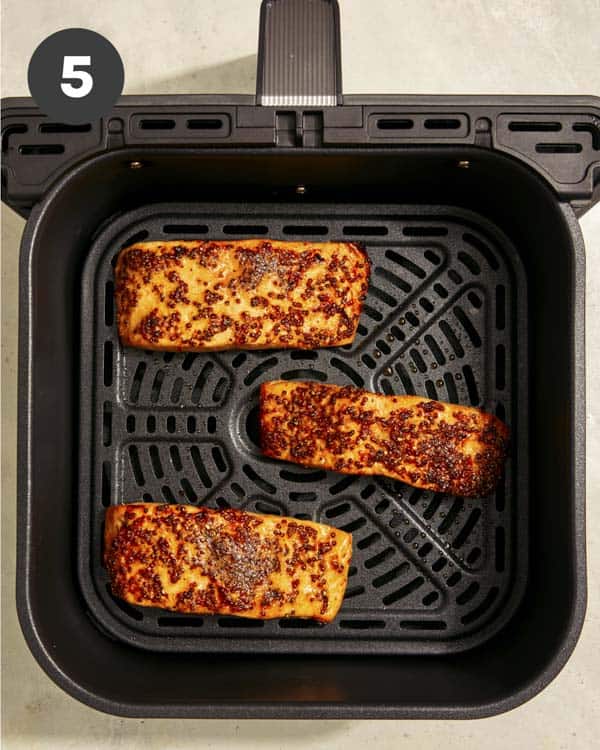Air fryer salmon cooked in an air fryer.