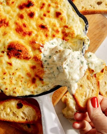 Baked garlic bread dip in a skillet.
