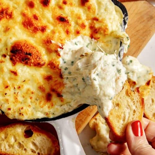 Baked garlic bread dip in a skillet.