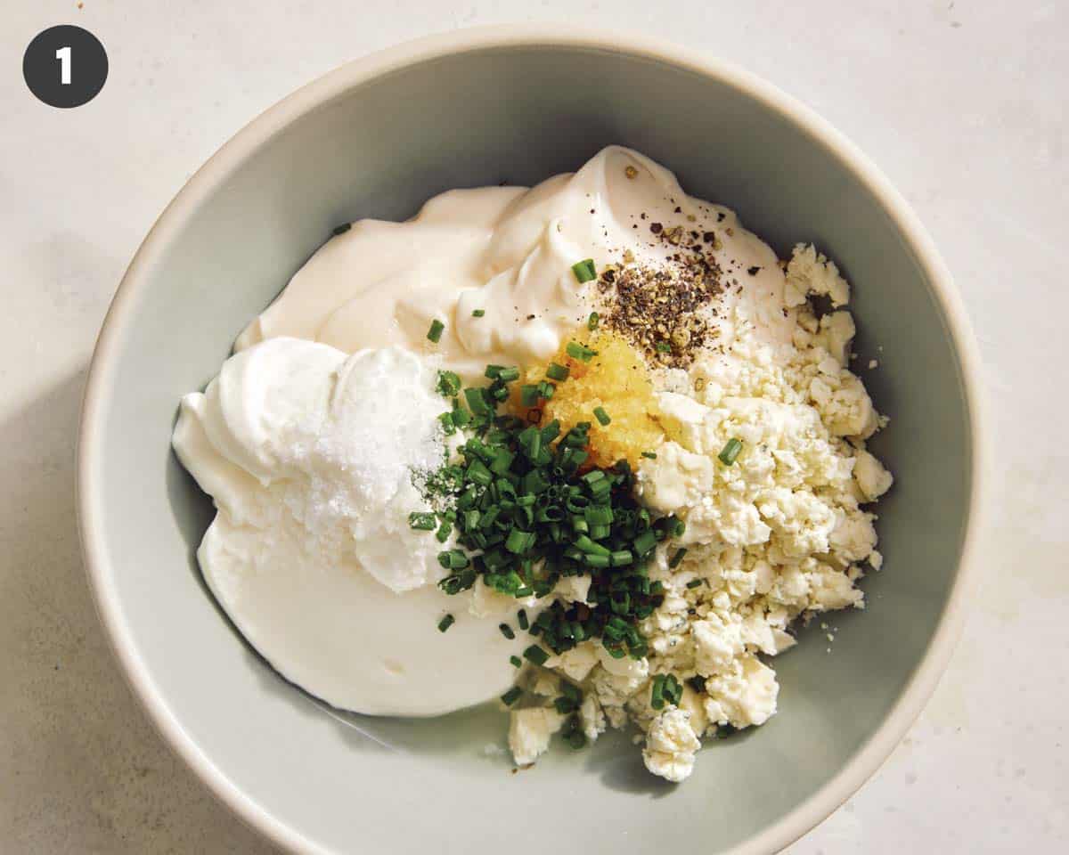 Blue cheese dressing recipe ingredients in a bowl.