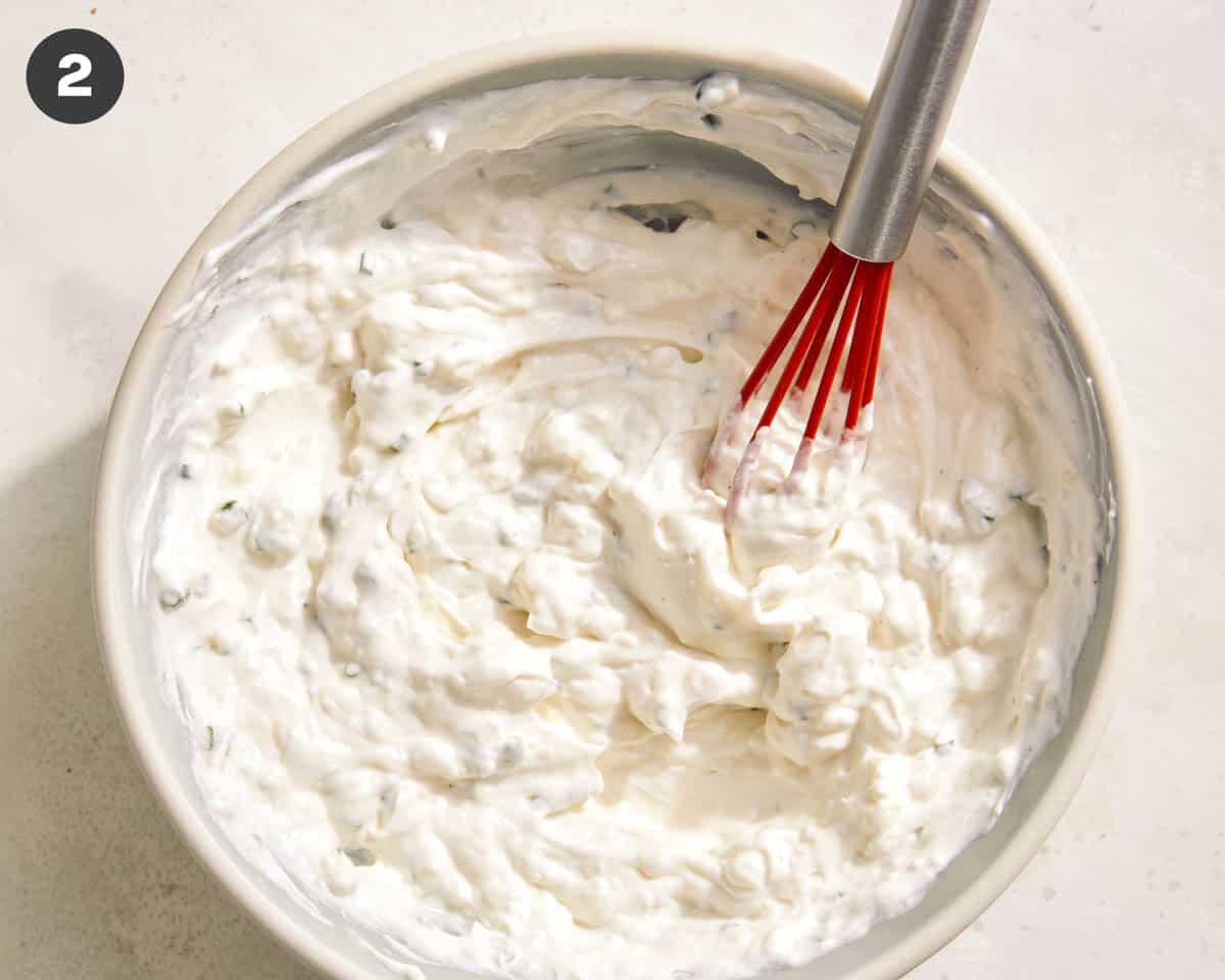 Blue cheese dressing in a bowl just whisked together. 