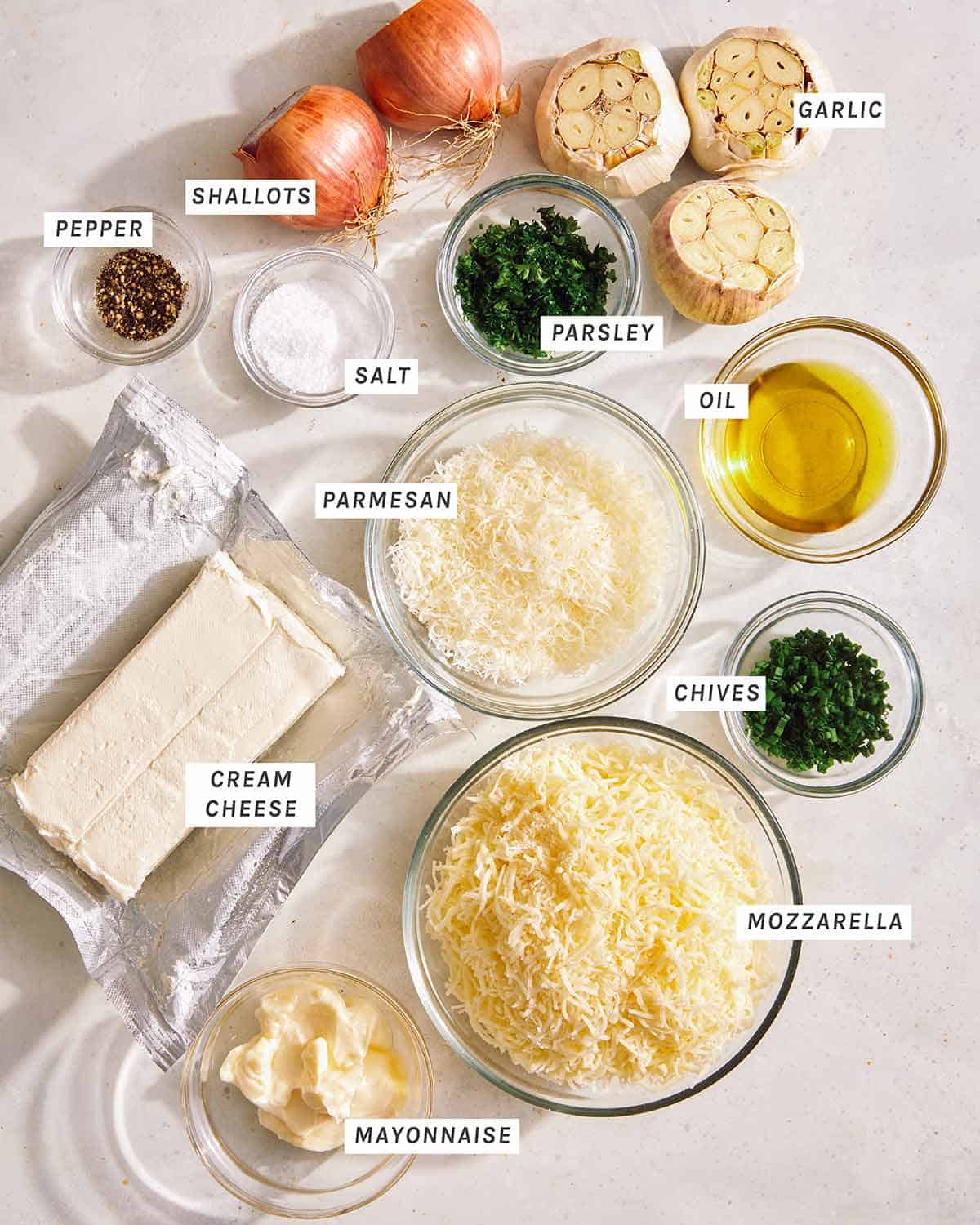 Ingredients to make a baked garlic bread dip.