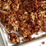 Homemade granola on a baking sheet.