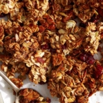 Homemade granola on a baking sheet.