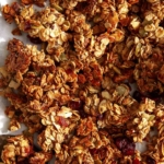 Homemade granola on a baking sheet.