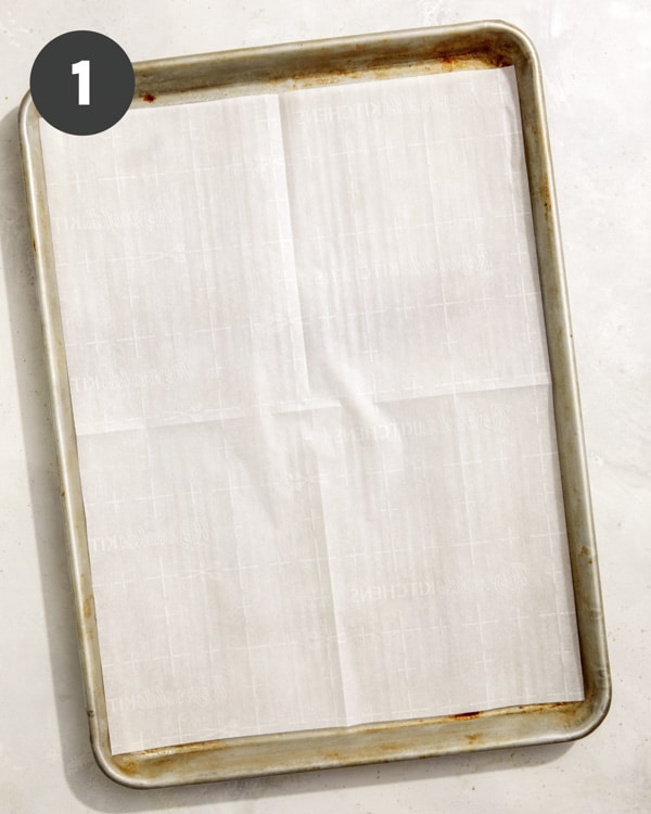 A baking sheet lined with parchment paper. 