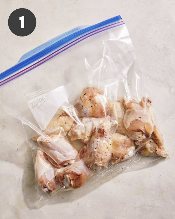 Wings in a bag with salt and pepper.