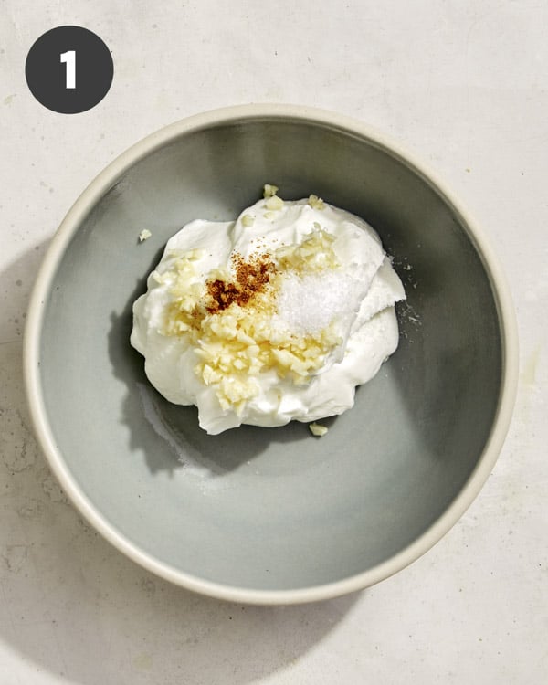 Ingredients for yogurt for turkish eggs in a bowl. 