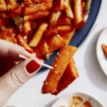 Tteokbokki recipe served with toothpicks.