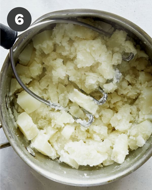 Mashed potatoes in a pot to make Browned Butter Colcannon.