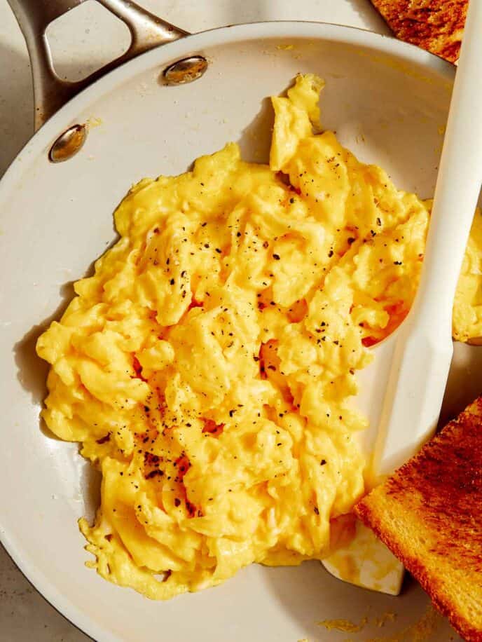 Scrambled eggs in a skillet.