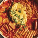 Korean Army Stew or Budae Jjigae in a pot ready to be served.