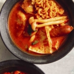 Budae Jjigae in two bowls.