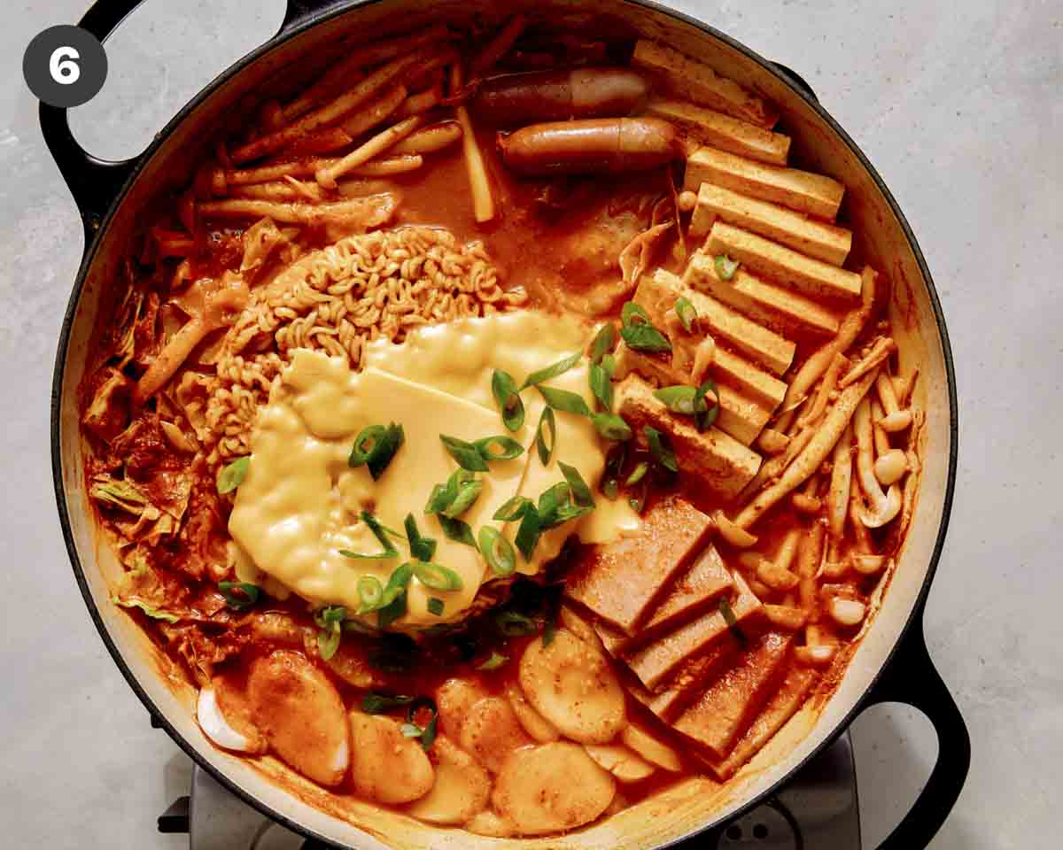 Budae Jjigae finished in a skillet ready to be served.