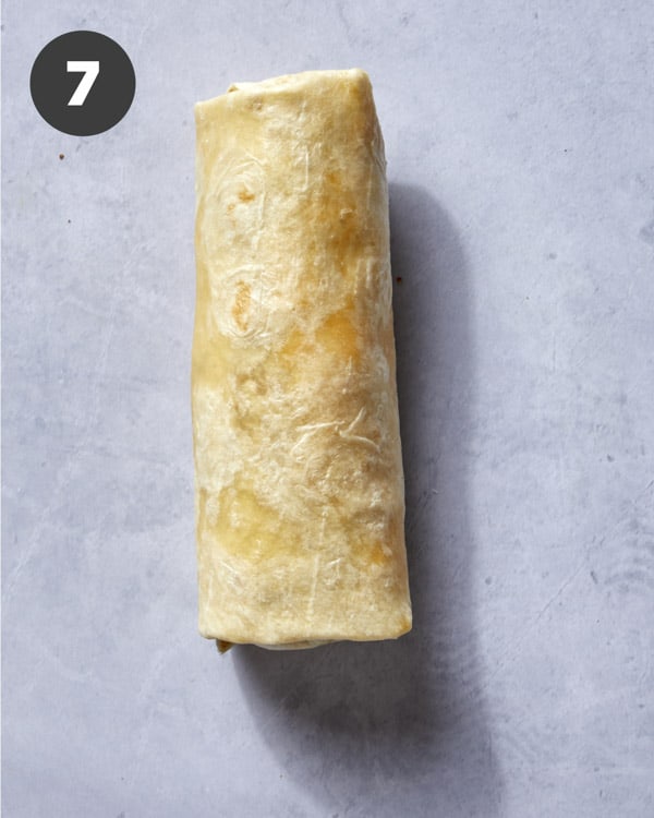 A breakfast burrito rolled up.
