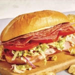 An Italian grinder sandwich on a cutting board.