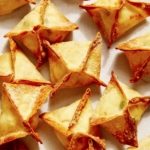 Air fryer crab rangoon on a counter.