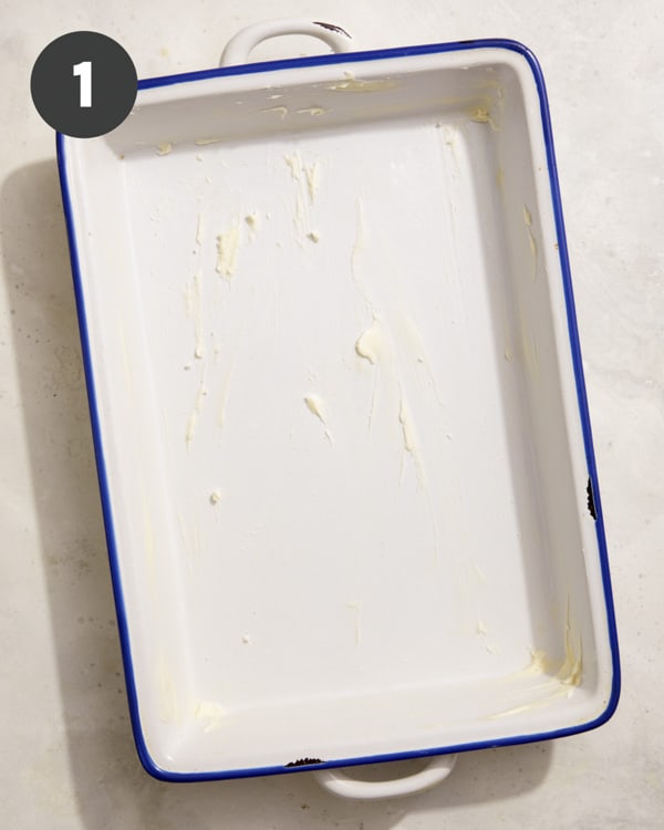 A buttered baking dish for bread pudding.