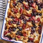 Triple berry bread pudding with glaze on top.