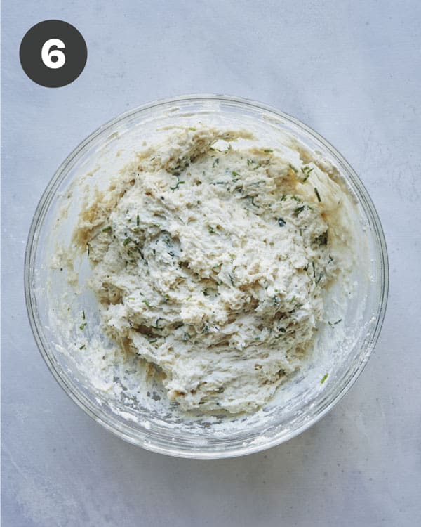 Drop biscuit dough in a bowl ready to be scooped.