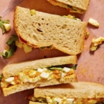 Egg salad sandwiches cut in half.