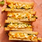 An easy egg salad sandwich recipe shown by egg salad sandwiches cut in half.