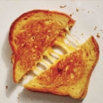 Perfect grilled cheese recipe cut in half.