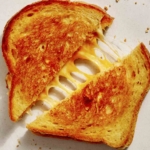 Perfect grilled cheese recipe cut in half.