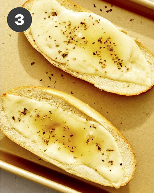 An Italian roll with provolone cheese melted in the oven.