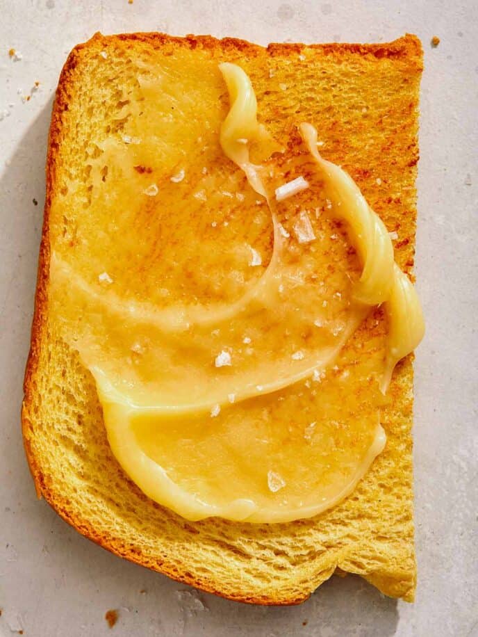 Honey butter smeared on a piece of toast. 