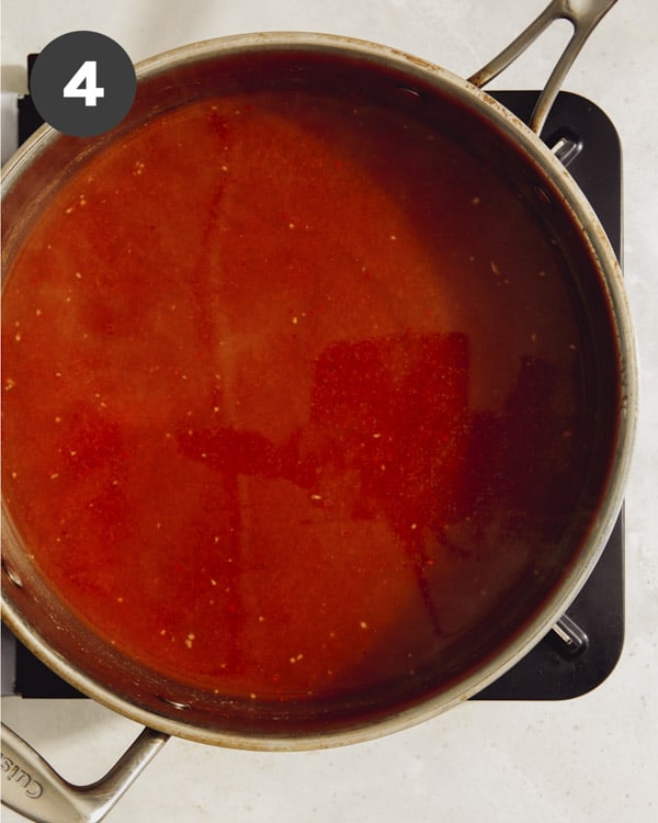 Tteokbokki sauce simmering in a pot.