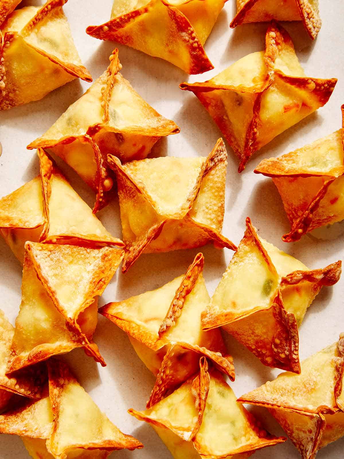 Air fryer crab rangoon on a counter.