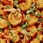 Bang bang shrimp close up on a plate.