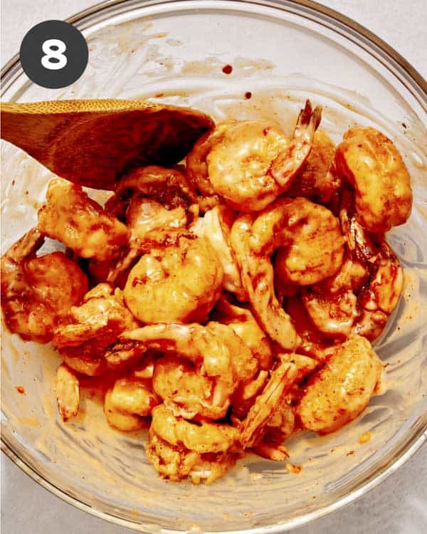 Bang bang shrimp recipe in a bowl with sauce mixed together. 