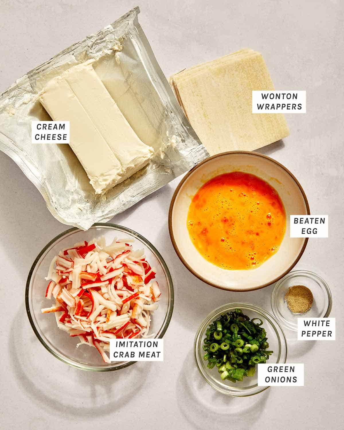 Air fryer crab rangoon ingredients on a kitchen counter. 
