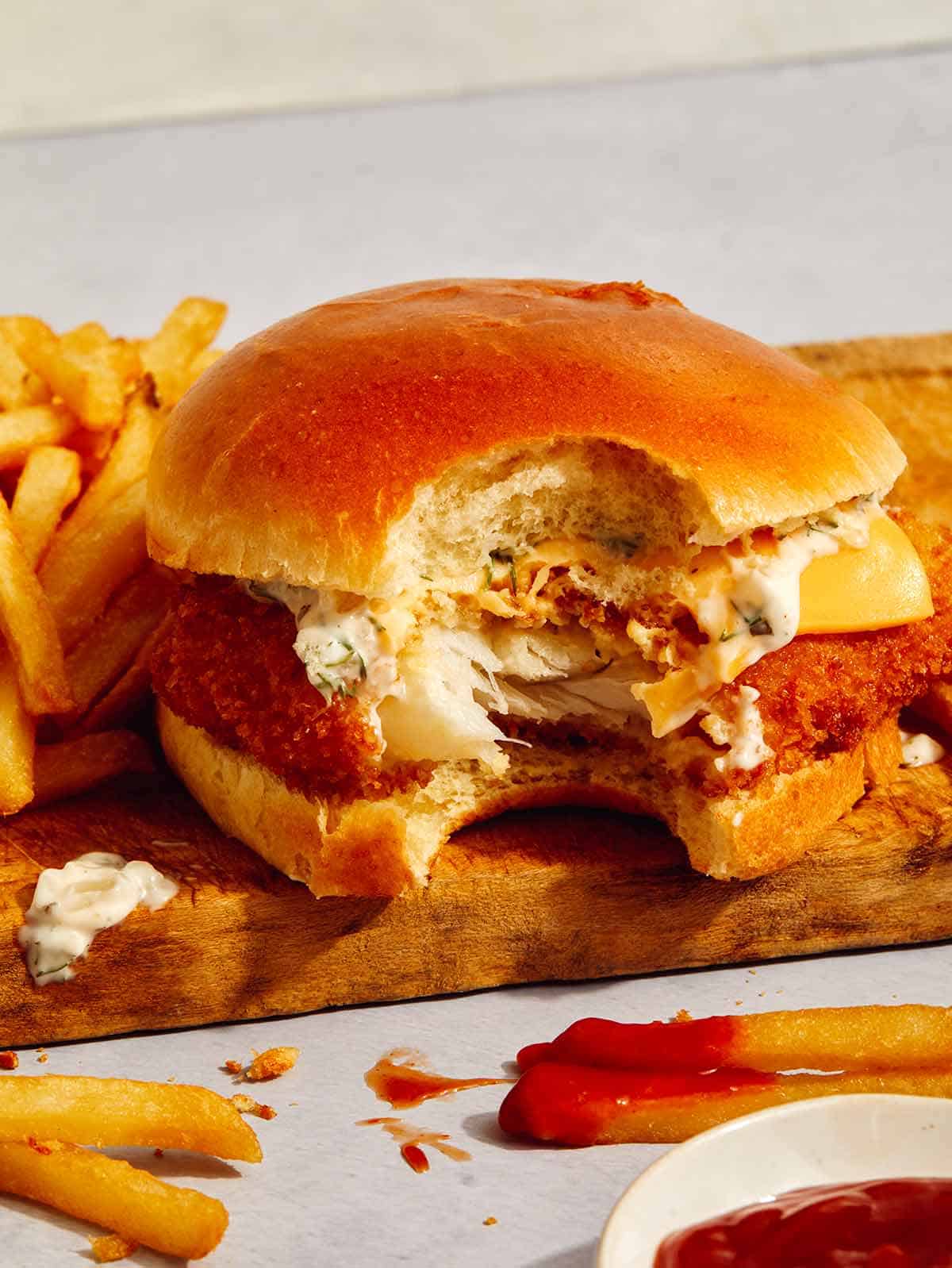 Filet o fish sandwich with a bite taken out. 