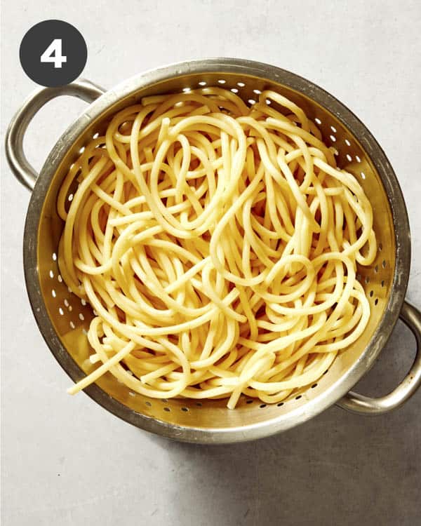 Pasta cooked and drained in a colander.