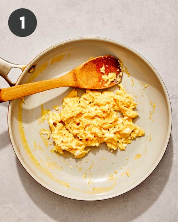 Scrambled eggs in a skillet.