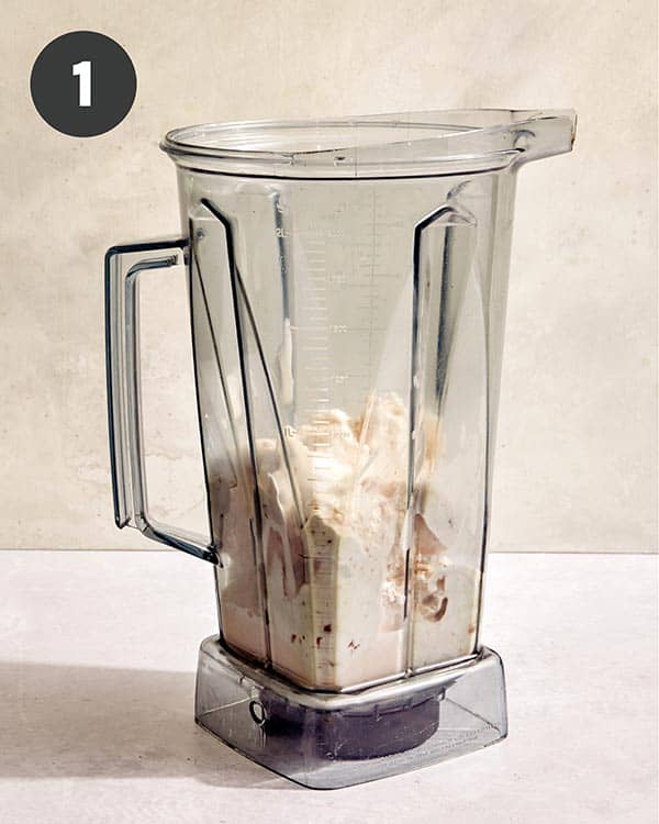 Ice cream and milk in a blender. 