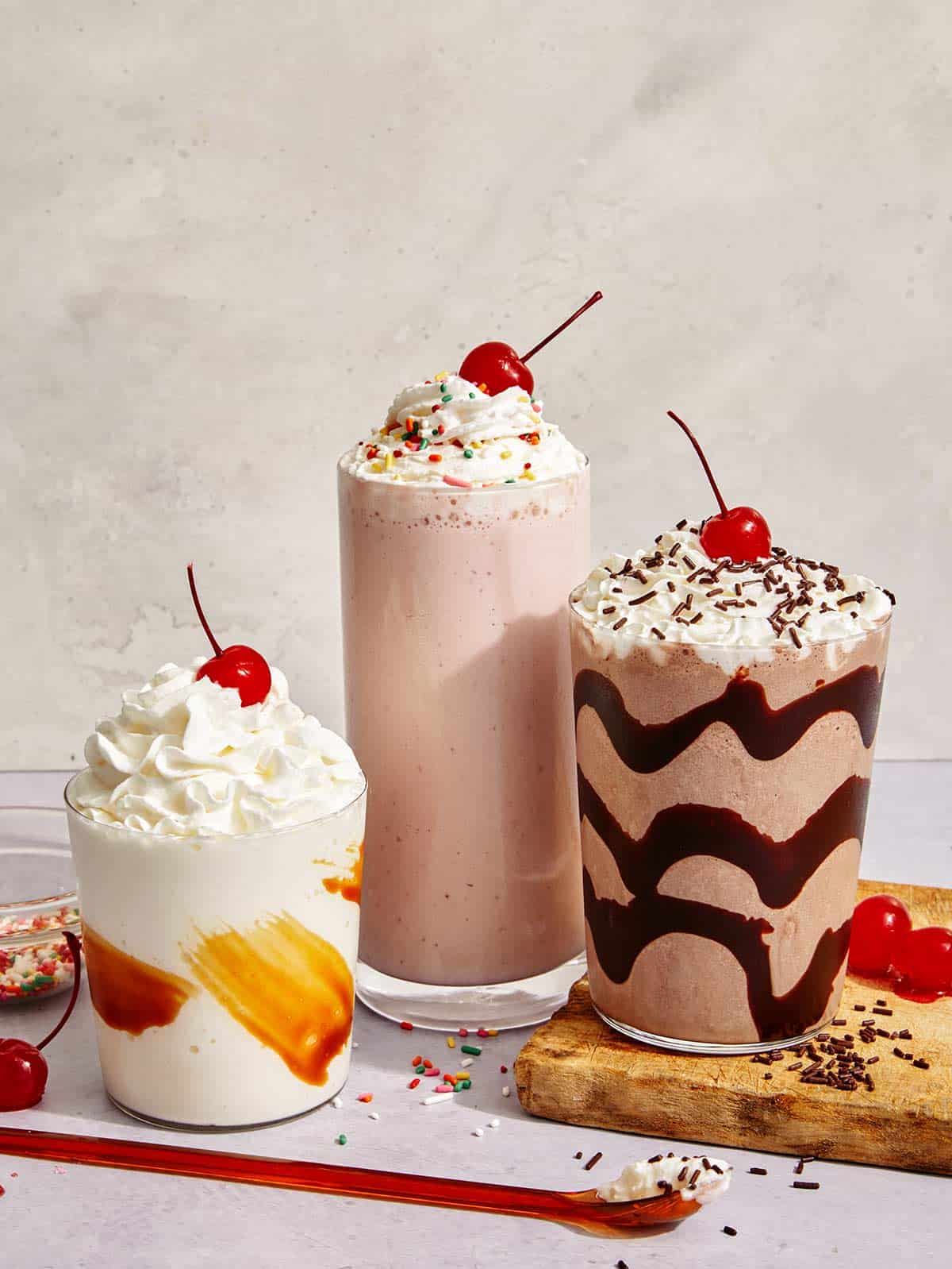 Milkshakes made from the same base recipe in different flavors.