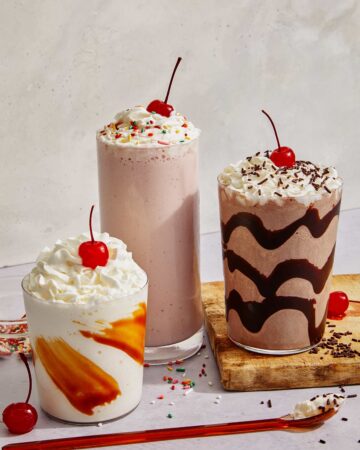 Milkshake recipes in three glasses in different flavors.