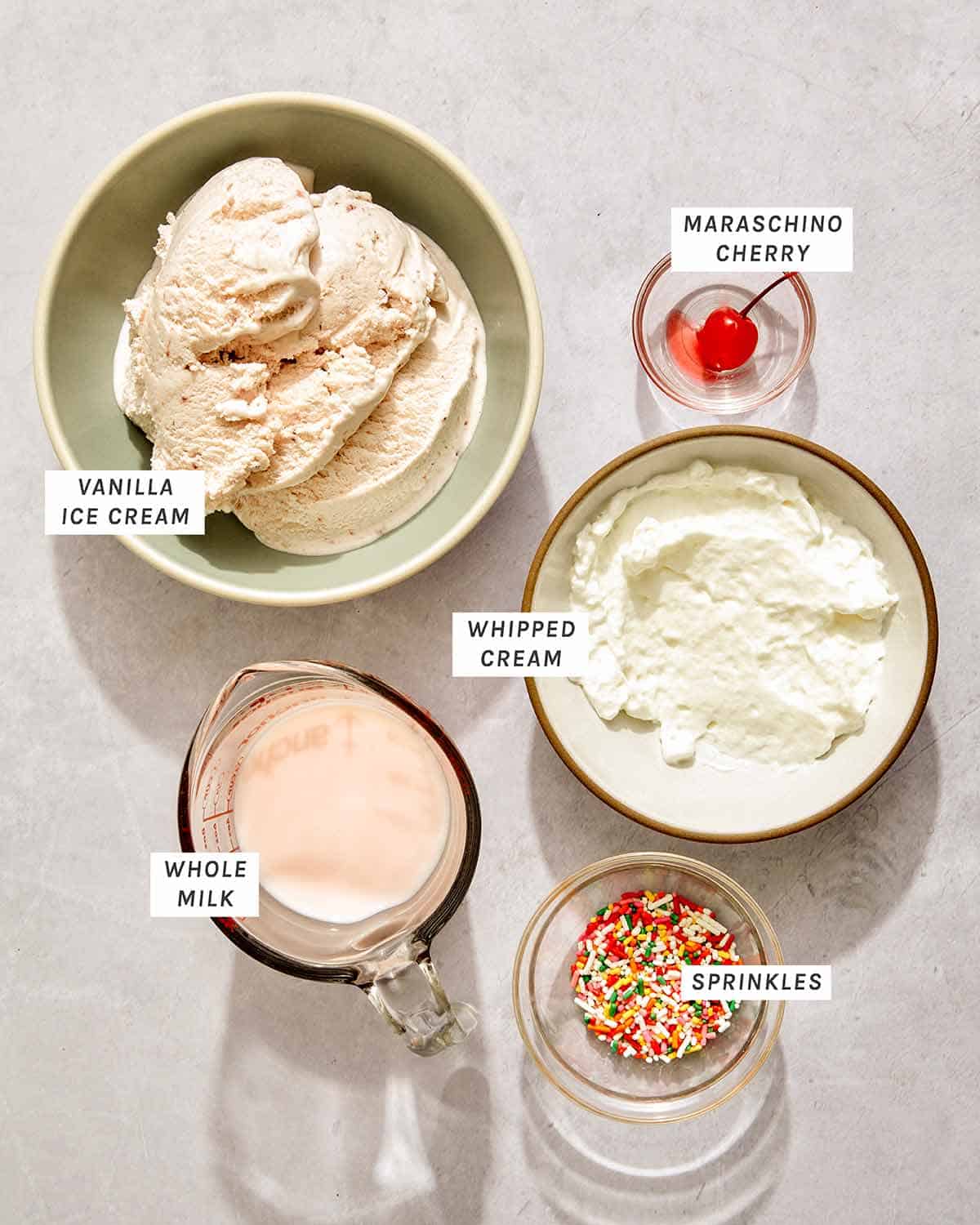 Milkshake recipe ingredients on a kitchen counter. 