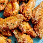 Air fryer chicken wings on a platter.