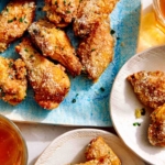 Air fryer chicken wings on a platter.