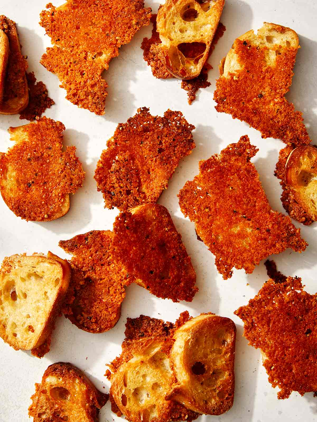 A bunch of parmesan crusted crostini.