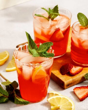 Strawberry lemonade in glasses with garnish.