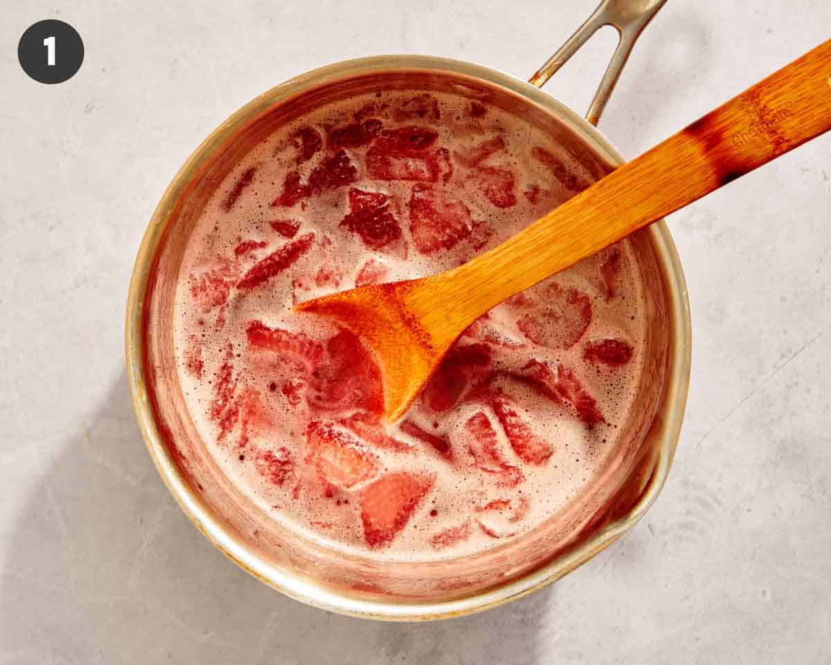 Strawberries stewing in a pot. 