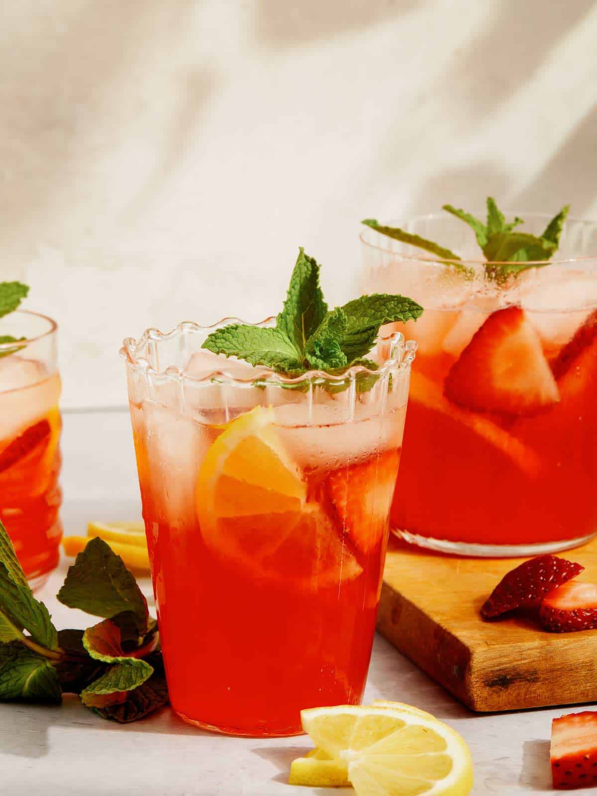 Strawberry lemonade with a mint garnish in glasses. 